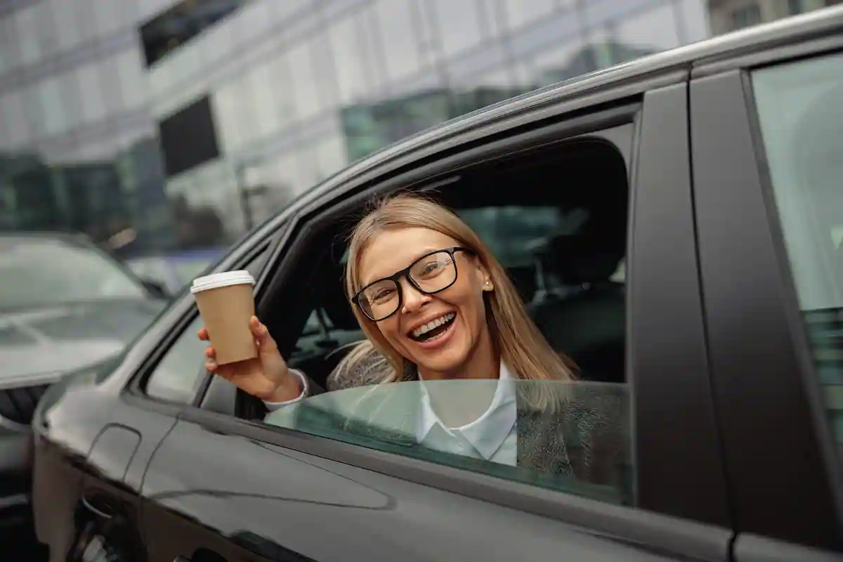 smiling-woman-passenger-in-eyeglasses-drinking-tak-2023-03-17-22-55-49-utc-2-2